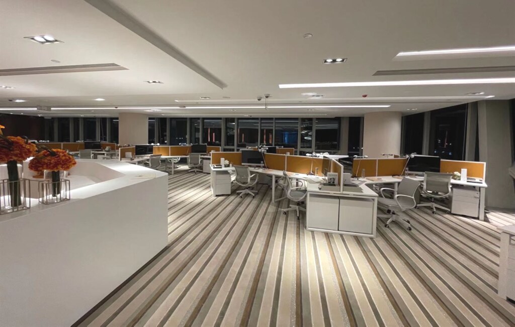 Open-Plan Floor — full workstation fit-out, night view