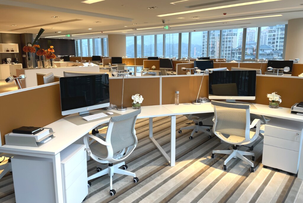 Workstation Area — ergonomic benching with amber-panel screens